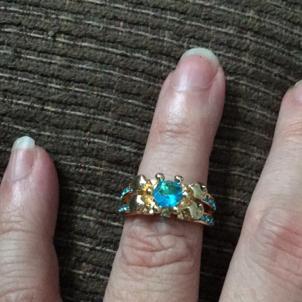Gold tone light blue stones size 7 ring